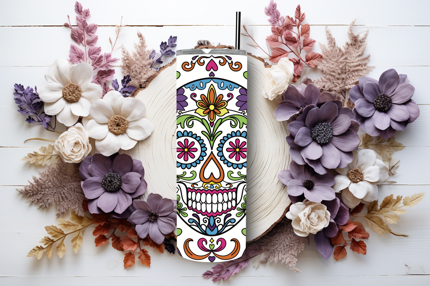 20oz stainless steel tumbler featuring a vibrant ‘Sugar Skull’ design with colorful floral patterns. Sized for Starbucks Venti drinks, it offers double-wall insulation to keep beverages hot for up to 6 hours and cold for up to 12 hours. Comes with a spill-resistant lid and straw. Eco-friendly and reusable. Actual product color may vary from the images shown.
