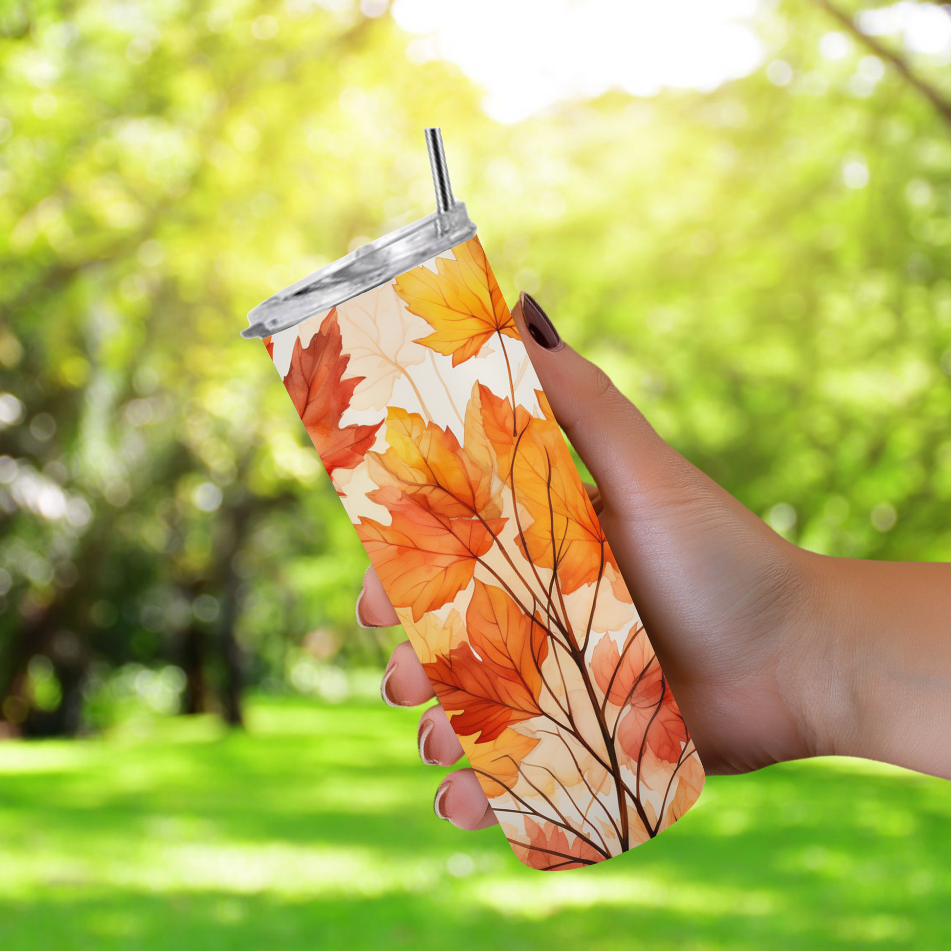 20oz stainless steel tumbler with a vibrant autumn leaves design, sized for Starbucks Venti drinks. Features double-wall insulation that keeps beverages hot for up to 6 hours and cold for up to 12 hours. Comes with a spill-resistant lid and straw, perfect for eco-friendly, reusable travel. Actual product color may vary from the images shown.