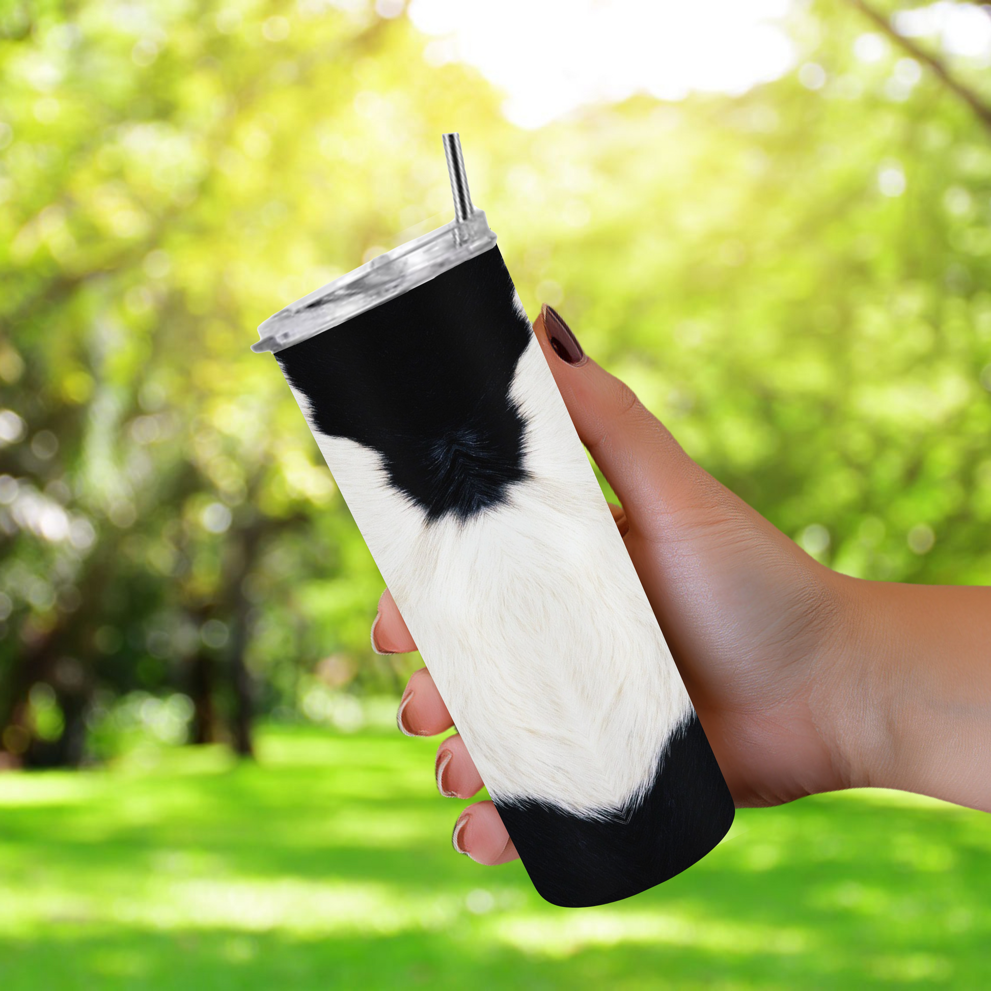 20oz stainless steel tumbler with a trendy black-and-white cow print, sized for Starbucks Venti drinks. Features double-wall insulation to keep beverages hot for up to 6 hours and cold for up to 12 hours. Comes with a spill-resistant lid and straw, perfect for eco-friendly, reusable travel. Actual product color may vary from the images shown.