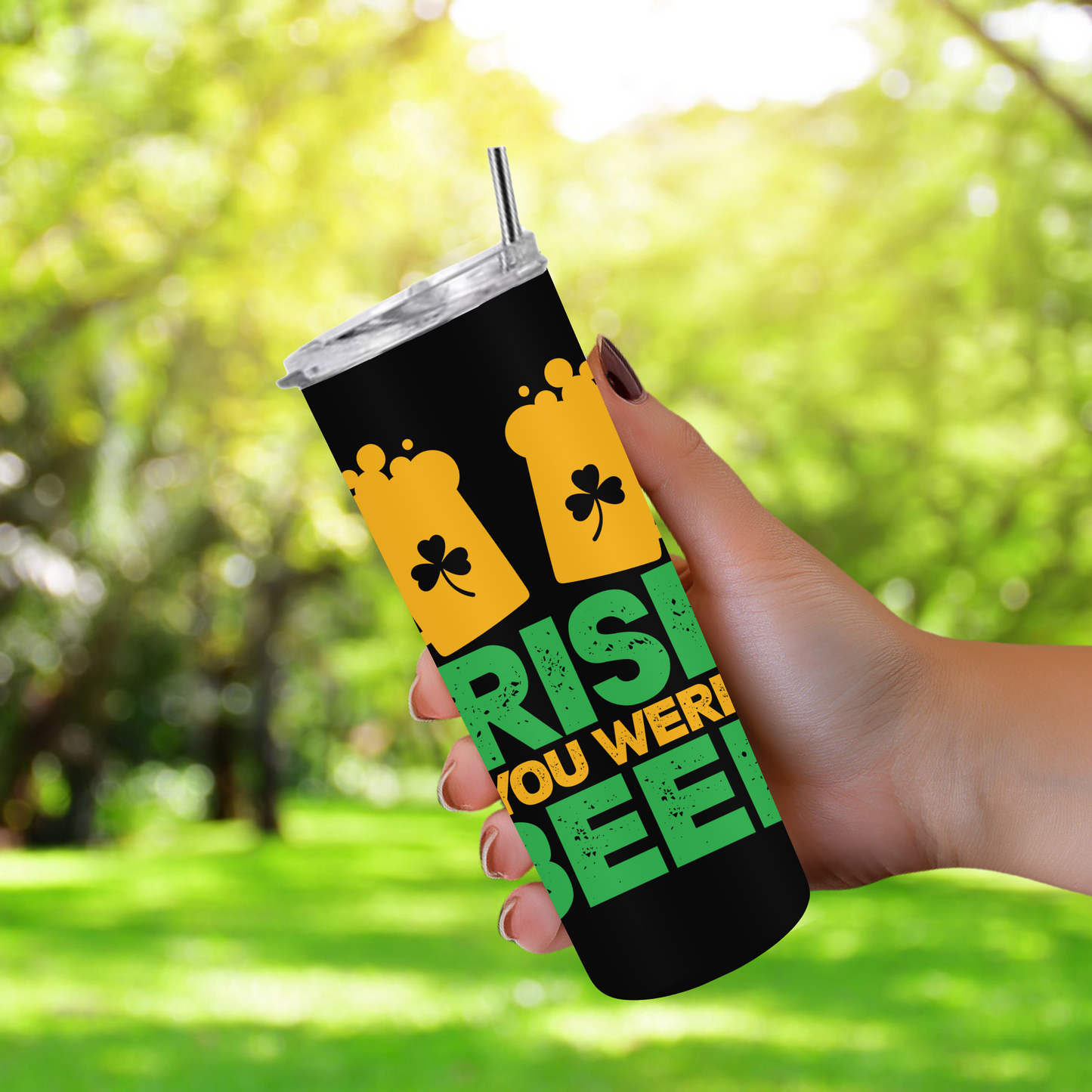 20oz stainless steel tumbler featuring the ‘Irish You Were Beer’ design with beer mugs and shamrocks. Sized for Starbucks Venti drinks, it offers double-wall insulation to keep beverages hot for up to 6 hours and cold for up to 12 hours. Includes a spill-resistant lid and straw. Eco-friendly and reusable. Actual product color may vary from the images shown.