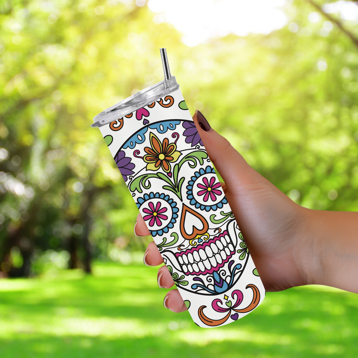 20oz stainless steel tumbler featuring a vibrant ‘Sugar Skull’ design with colorful floral patterns. Sized for Starbucks Venti drinks, it offers double-wall insulation to keep beverages hot for up to 6 hours and cold for up to 12 hours. Comes with a spill-resistant lid and straw. Eco-friendly and reusable. Actual product color may vary from the images shown.
