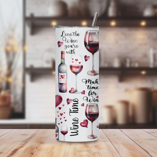 20oz stainless steel tumbler featuring a charming ‘Wine is Magical’ design with wine bottles, glasses, and heart motifs. Sized for Starbucks Venti drinks, it offers double-wall insulation to keep beverages hot for up to 6 hours and cold for up to 12 hours. Comes with a spill-resistant lid and straw. Eco-friendly and reusable. Actual product color may vary from the images shown.