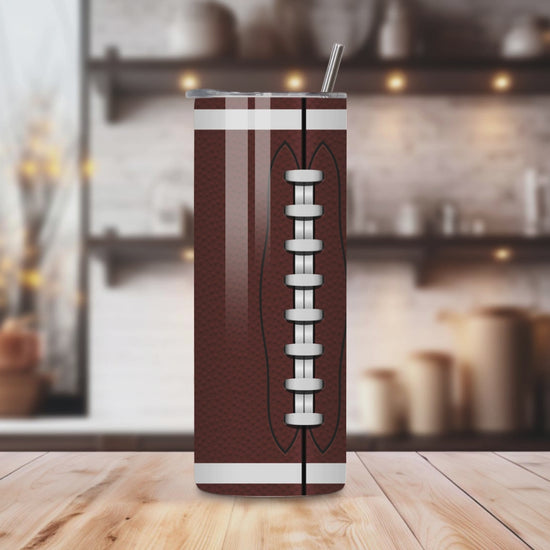 20oz stainless steel tumbler with a classic football design, sized for Starbucks Venti drinks. Features double-wall insulation to keep beverages hot for up to 6 hours and cold for up to 12 hours. Includes a spill-resistant lid and straw, perfect for eco-friendly, reusable use. Actual product color may vary from the images shown.