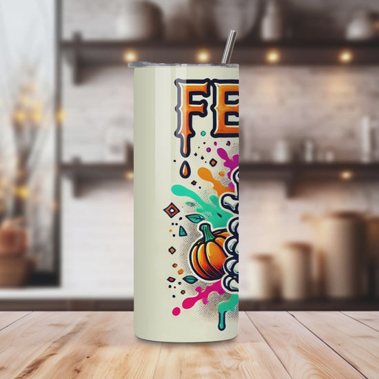 20oz stainless steel tumbler featuring a vibrant ‘Feeling Pumpkin Spice’ design with a skeleton hand holding a pumpkin spice latte. Sized for Starbucks Venti drinks, it offers double-wall insulation to keep beverages hot for up to 6 hours and cold for up to 12 hours. Comes with a spill-resistant lid and straw. Eco-friendly and reusable. Actual product color may vary from the images shown.