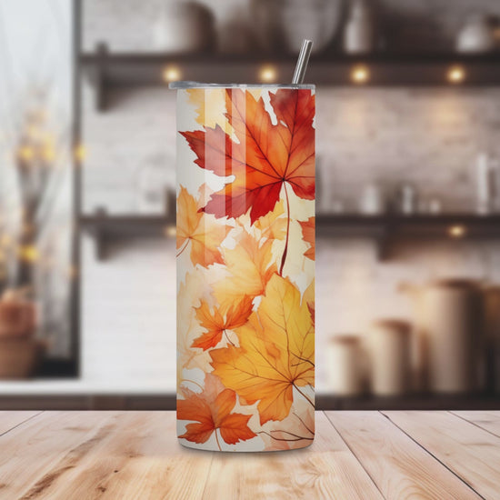 20oz stainless steel tumbler with a vibrant autumn leaves design, sized for Starbucks Venti drinks. Features double-wall insulation that keeps beverages hot for up to 6 hours and cold for up to 12 hours. Comes with a spill-resistant lid and straw, perfect for eco-friendly, reusable travel. Actual product color may vary from the images shown.